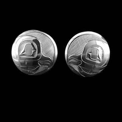 These circle stud earrings are made using sterling silver and have depictions of the head of the Owl carved into the surface of them. The designs show the side profile of the Legend.