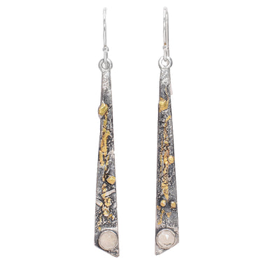 These tapered smoky quartz earrings are made from sterling silver and have designs carved into them and 24K gold highlights. At the bottom of the hangs are smokey quartz gemstones.
