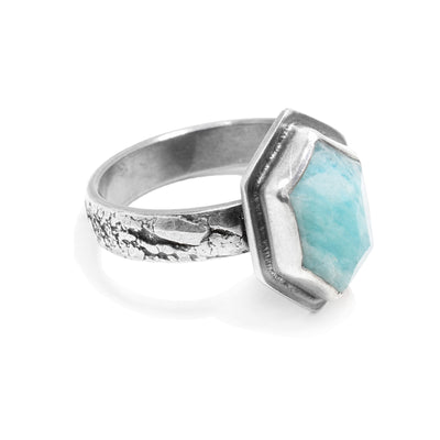 This sterling silver ring has a textured band with a hexagon amazonite gem wrapped in silver.