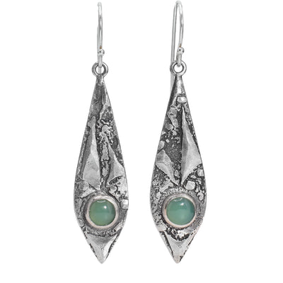 These silver dangle earrings have sterling silver hooks with oxidized silver long, oval hangs. At the bottom of the hangs are round chrysoprase gemstones.