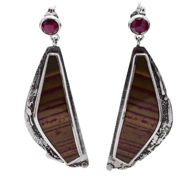 These stud, silver dangle earrings have garnet and sterling silver studs with chunky, triangular hangs made from jasper and oxidized silver. 