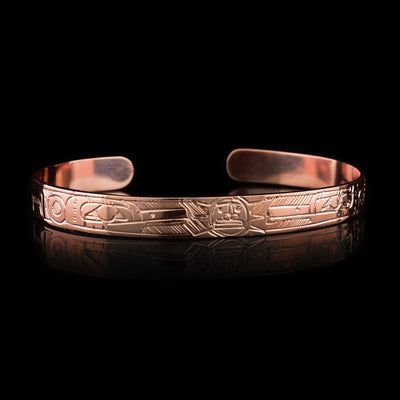 This Sun and Hummingbird bracelet is made using copper and has a thin band with a gap in the back. There are two depictions of the Hummingbird facing each other with the Sun depicted in the center of the legends that have been carved into the surface of the band. The legends meet at the top of the band.