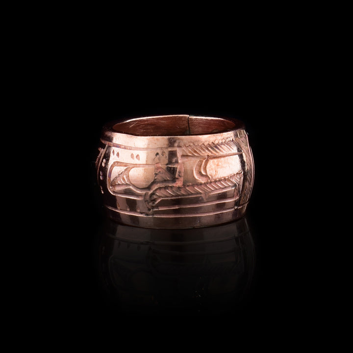 This Eagle spirit bead is a copper charm and has a depiction of the Eagle carved into the surface of the bead.
