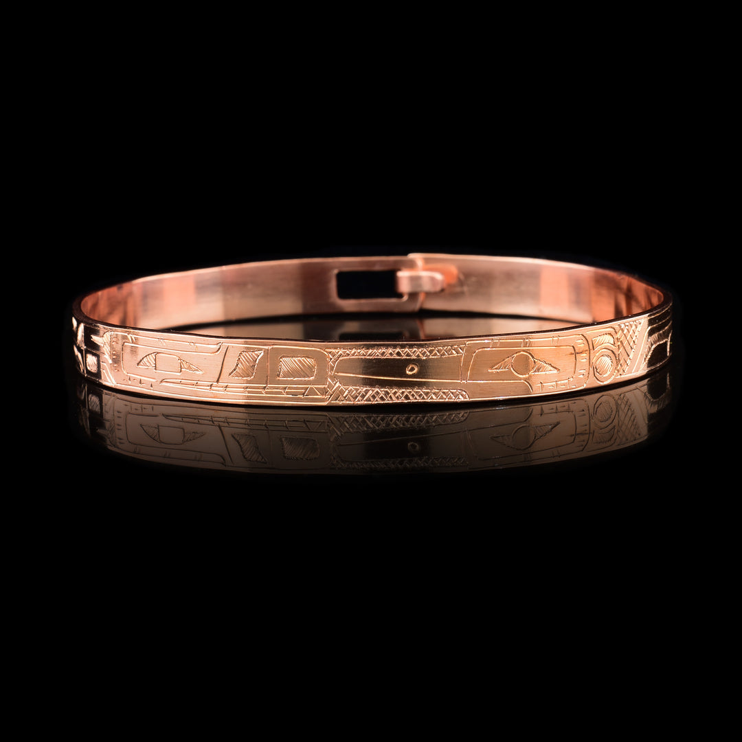 This Hummingbird and Wolf bracelet ahs a single, thin and coper and with a clasp in the back. There are depictions of the Hummingbird and the Wolf carved into the surface of the band.