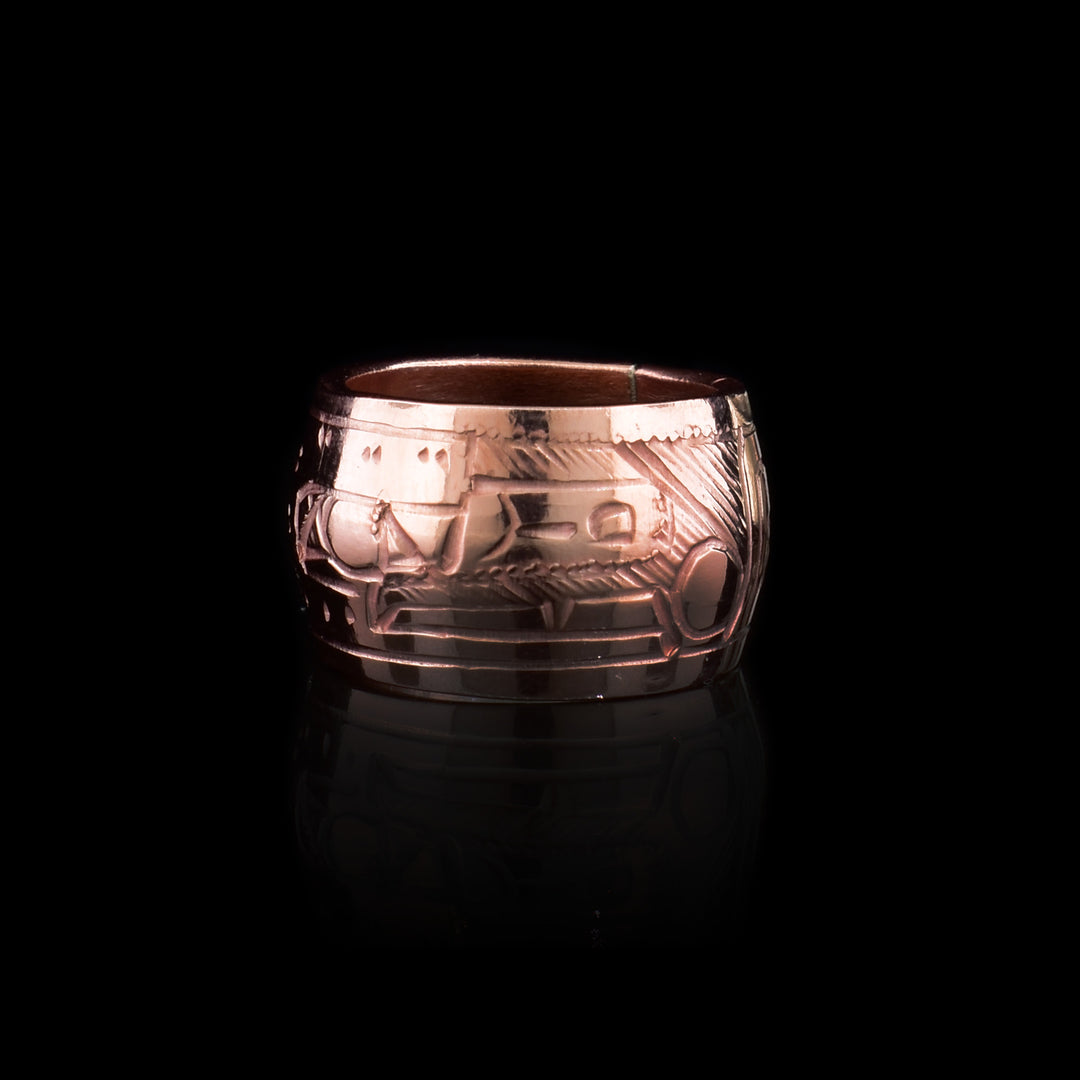 Another version of the bead which has a thinner shape and a depiction of the Raven holding a pearl carved across the surface of them.