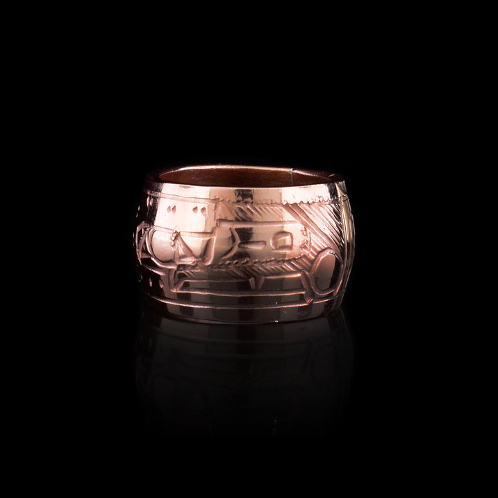 Another version of the bead which has a thinner shape and a depiction of the Raven holding a pearl carved across the surface of them.