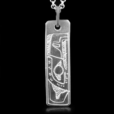 This sterling silver pendant is rectangular and has the face of the Eagle carved in the bottom. The Eagle is facing upwards.