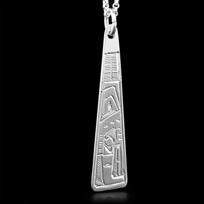 This pendant is made out of sterling silver. It has the shape of a long triangle. The face of the Eagle is carved on it, facing downwards.