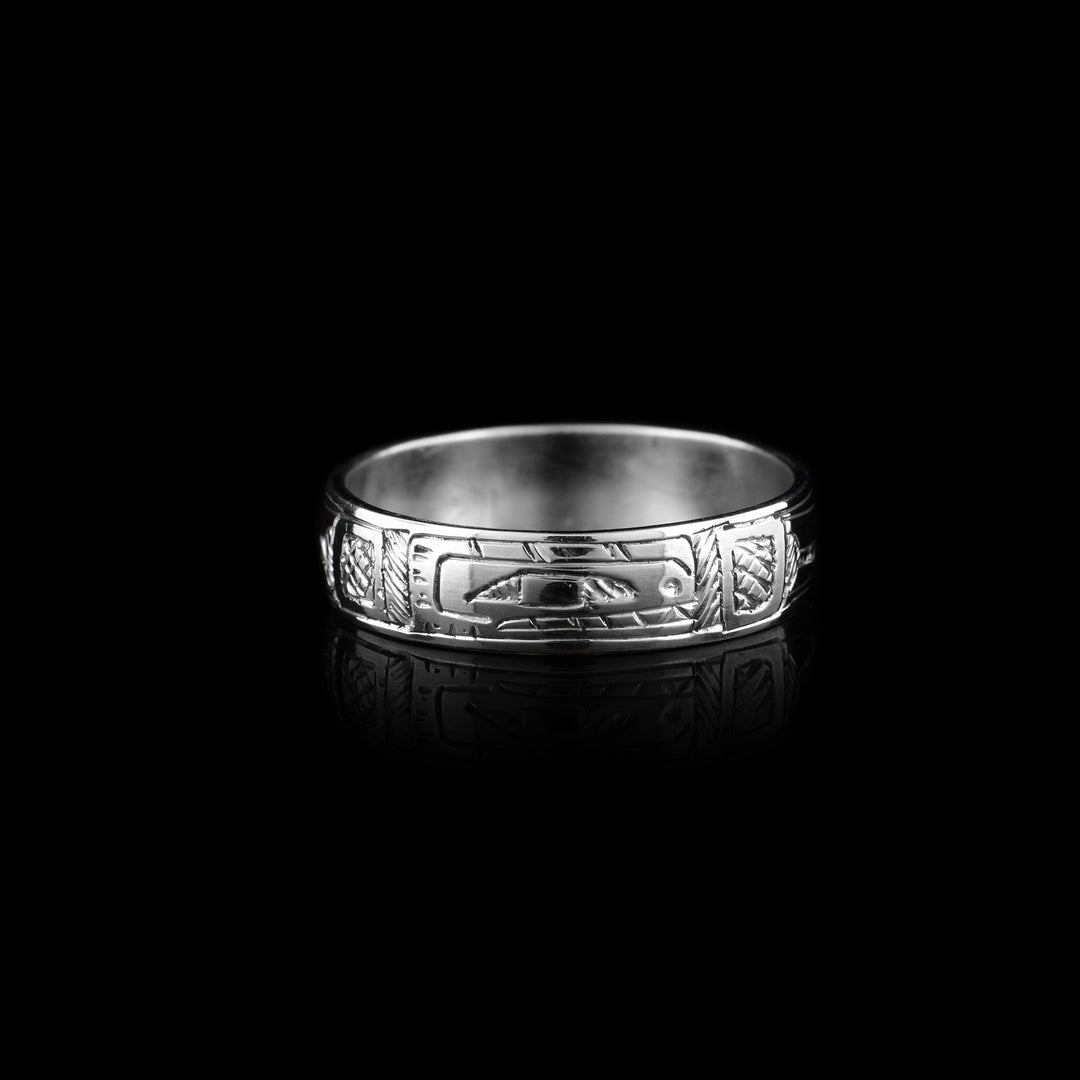 The Orca ring is made out of sterling silver. The Orca's face is carved on one side of the band. The rest of the band has the Orca's body carved on it.