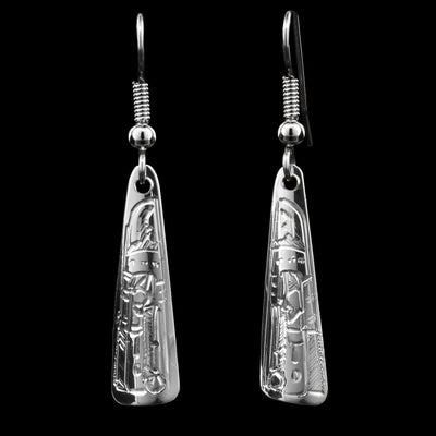 These triangular drop earrings are made from sterling silver and have long triangular hangs with rounded edges. There are depictions of the Raven that have been beautifully carved into the surface of the hangs.