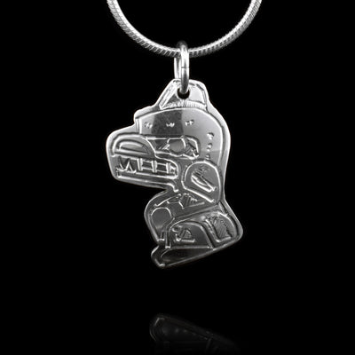 This Mini Bear pendant is made from sterling silver. The pendant is shaped like and has carvings on the surface of it that depict the Bear.