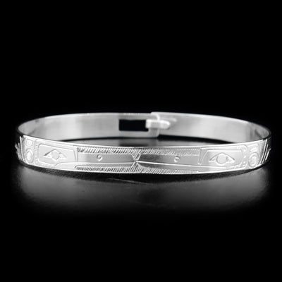 This Hummingbird bracelet is made from sterling silver and there are two depictions of the Hummingbird carved into the band. The band is thin and there is a clasp at the back.