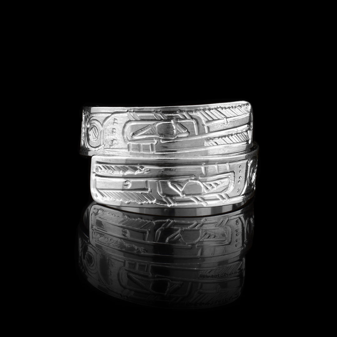 This sterling silver Hummingbird ring has a band that wraps around the finger twice. There is a depiction of the Hummingbird carved into the surface of the band.