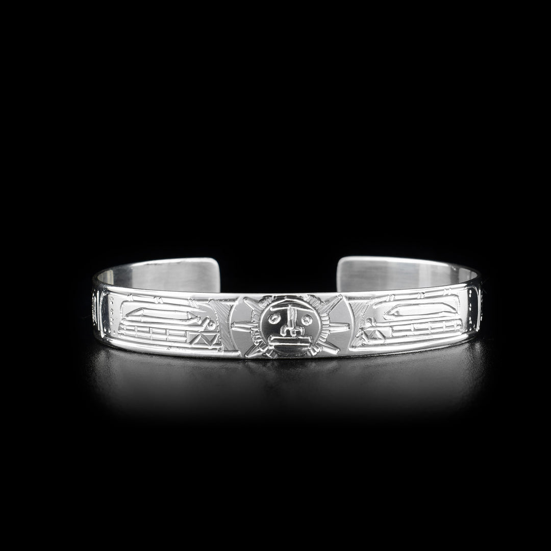 This Orca and Sun bracelet is made from sterling silver and there are two depictions of the Orca and a depiction of the Sun carved into the band of the cuff bracelet.