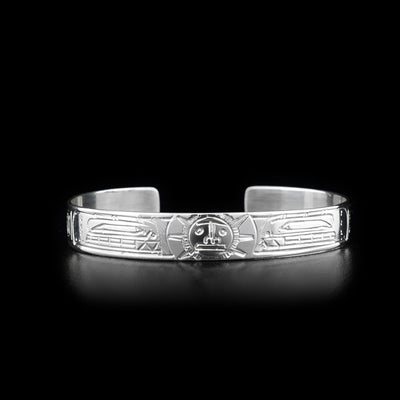 This Orca and Sun bracelet is made from sterling silver and there are two depictions of the Orca and a depiction of the Sun carved into the band of the cuff bracelet.