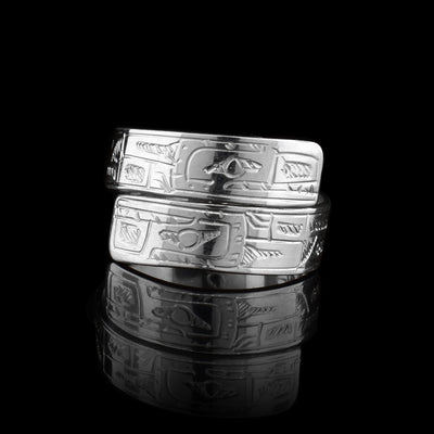 This sterling silver wrap ring wraps around the finger twice. There is a depiction of the Orca carved into the band.