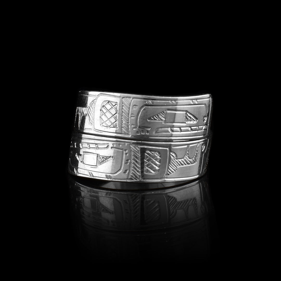 This double Orca ring is made form sterling silver and has a single band that wraps around the finger twice. There are depictions of the Orca carved into either end of the bands of this piece.