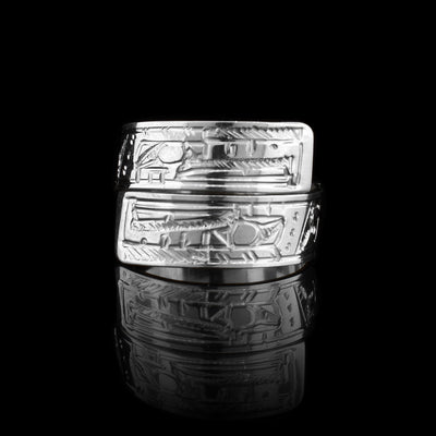 This sterling silver Thunderbird ring has a band that wraps around the finger twice. There is a depiction of the Thunderbird carved into the surface of the band.