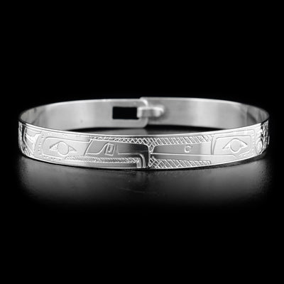 This Hummingbird and Eagle bracelet is made from sterling silver and there are depictions of the Hummingbird and Eagle carved into the band. There is a clasp at the back of it and the Legends are depicted facing each other at the top of the band.