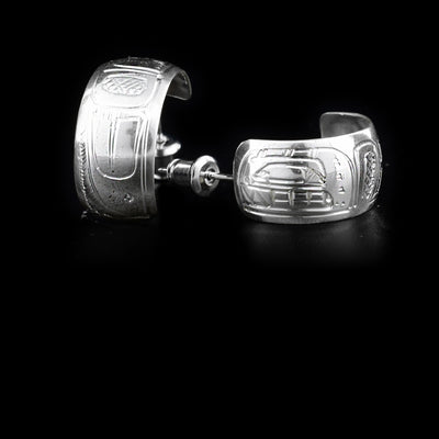 These sterling silver earrings are shaped like incomplete hoops and depict the face and body of the Orca.