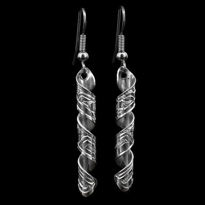 These dangling spiral earrings are made from sterling silver and the hangs are bands that have been coiled into a long spiral. The spiral hangs vertically and there is are depictions of the Hummingbird carved into the surface of them.