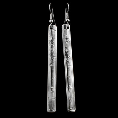 These Hummingbird long earrings are made from sterling silver and have long, thin and rectangle shaped hangs. There are beautiful carvings on the surface of the hangs that depict the Hummingbird.