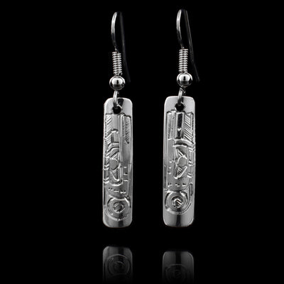 These sterling silver Hummingbird earrings have rectangular hangs and there are depictions of the Hummingbird  carved into them.