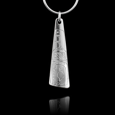 This sterling silver Orca pendant is triangular and there is a depiction of the Orca carved into it.