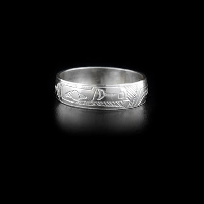 This sterling silver ring has a single thin band with the Raven carved into it