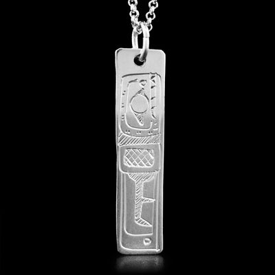 This pendant is shaped like a rectangle and has the face and fin of the Orca handcarved on it. The Orca is facing upwards.