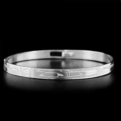 This sterling silver bracelet depicts the face of the Hummingbird on the front. There is a clasp in the back.