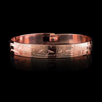 This Wolf bracelet is made from copper and has a single, thin band with a simple hook clasp in the back of it. There is a depiction of the Wolf that has been carved into the surface of the band.