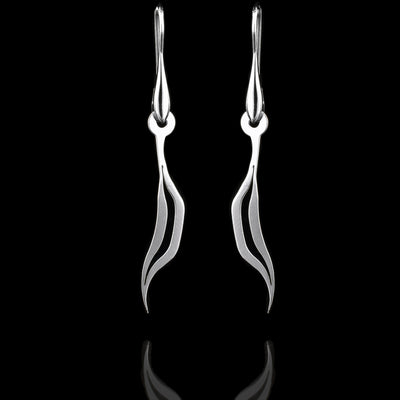 These sterling silver long dangling earrings have thin hangs that drop down and curve. The hangs depict a Haida Gwaii character.
