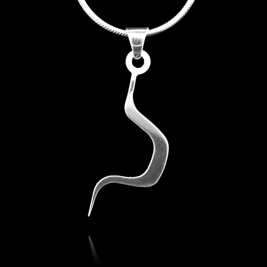 These sterling silver pendants drop down and have a large curve in the center of it. The piece depicts a Haida Gwaii character.