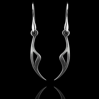 These sterling silver long dangling earrings have thin hangs that drop down and curve. The ends of the hangs have a triangular, claw shape.  The hangs depict a Haida Gwaii character.
