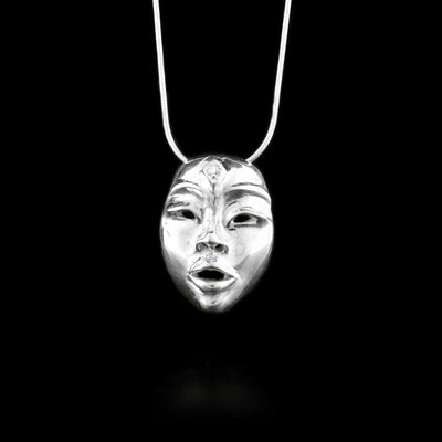 This diamond pendant is made from sterling silver and has been embossed to depict the face of the fenimide Seer. There are 3D eyes, mouth, eyebrow details and the pendant has a distinct face shape. The diamond is set on the forehead of the Seer.