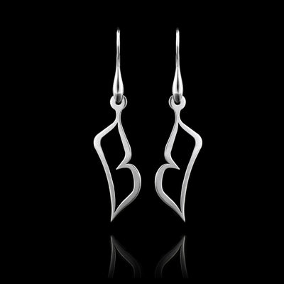 These sterling silver dangling earrings have thin hangs that depict a Haida Gwaii character.