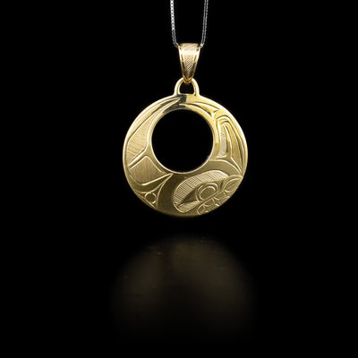 14K yellow gold pendant featuring orca design done in ovoids, cross-hatching and lines. Hand-carved by Haisla artist Hollie Bartlett.