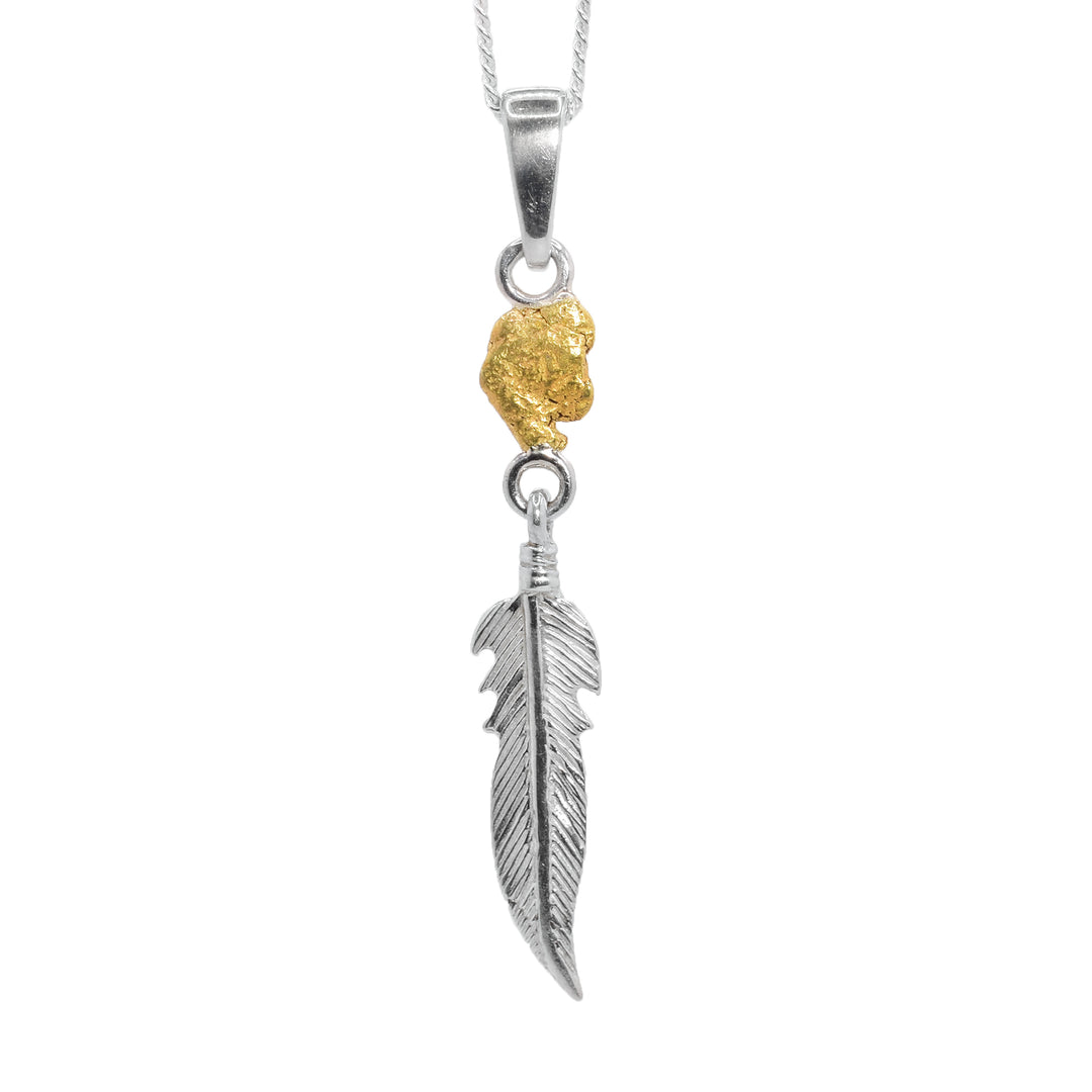 This feather pendant features a 22K gold nugget with a sterling silver feather dangling below. By Tom Gregorczyk.
