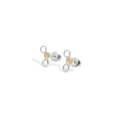 Each sterling silver stud is a set of three honeycombs, with the central one being filled with 22K gold nuggets. Handcrafted by Tom Gregorczyk.