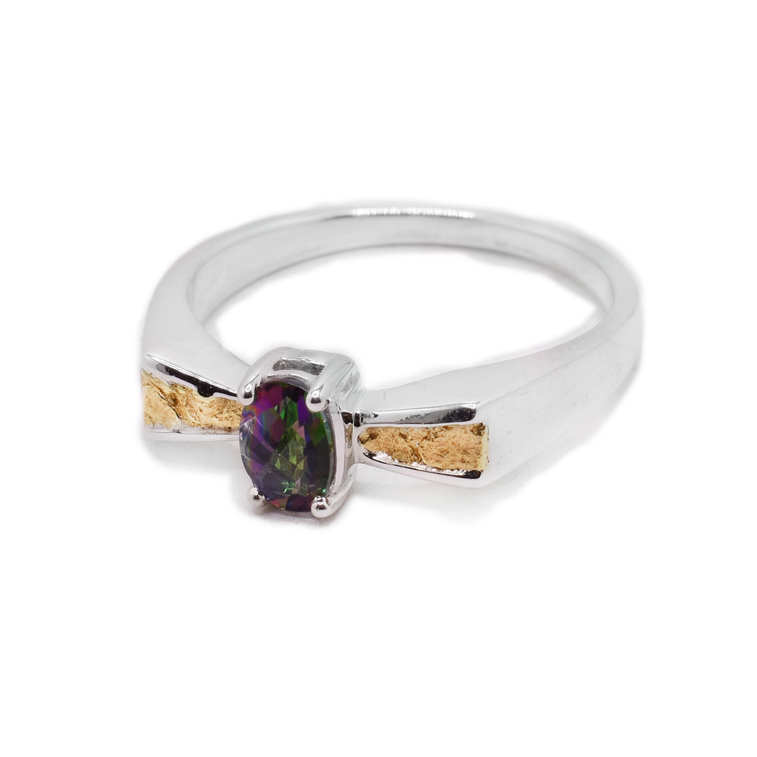 Sterling silver sluice ring with 22K gold nuggets in the front and a faceted, oval Northern Lights topaz in the center. Handcrafted by Tom Gregorczyk.