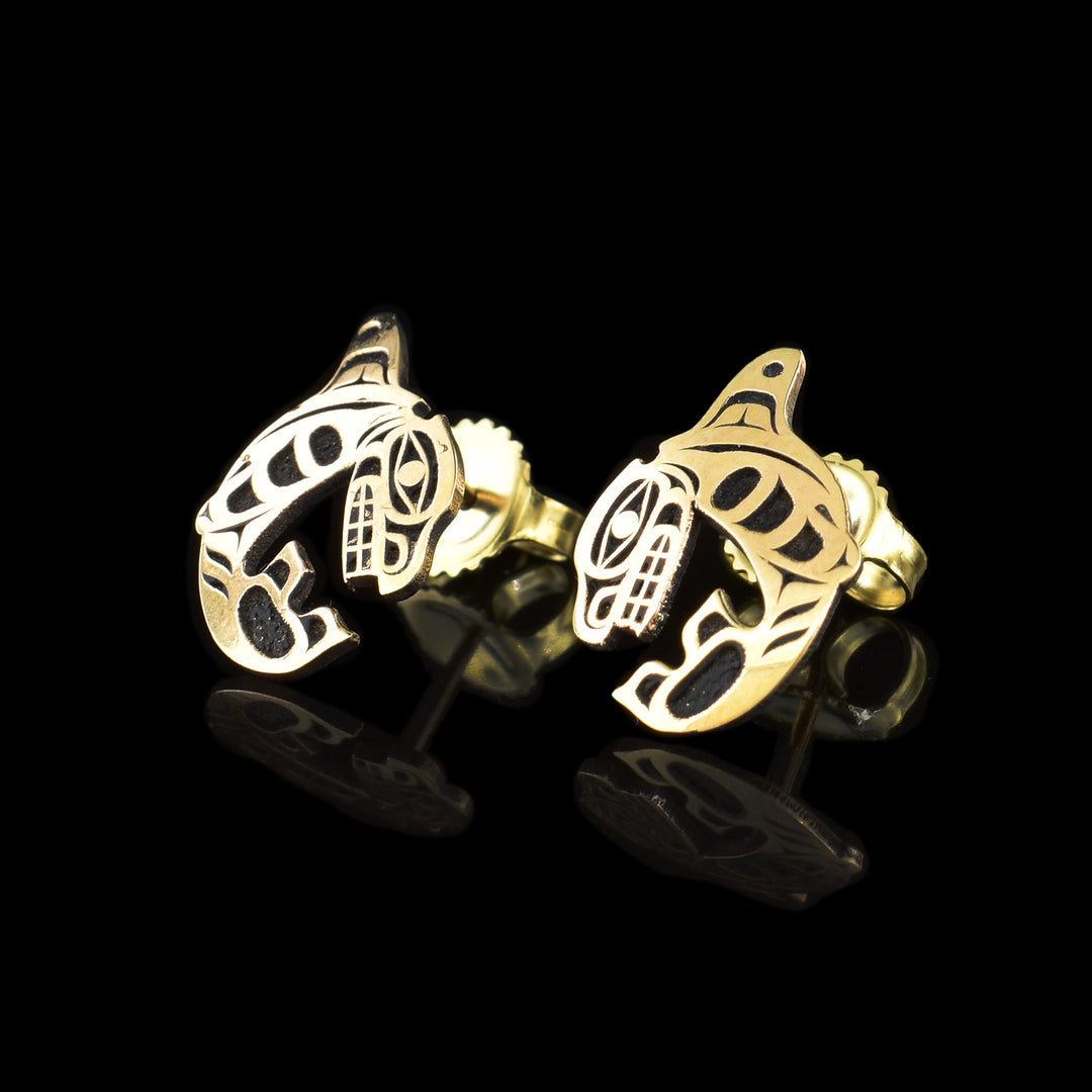These Gold Orca Earrings have been made using 14k Gold and are shaped like Orcas that are curled up in a round shape. The head of the Orca curves down and meets the tail and there are details of the Legend cast into the studs. Beautiful Gold Orca Earrings