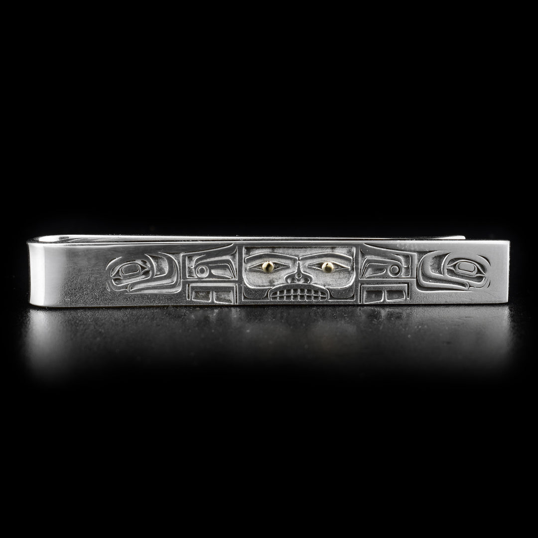 This tie clip features a Chilkat bentwood box, 18K gold in eyes on front of box.