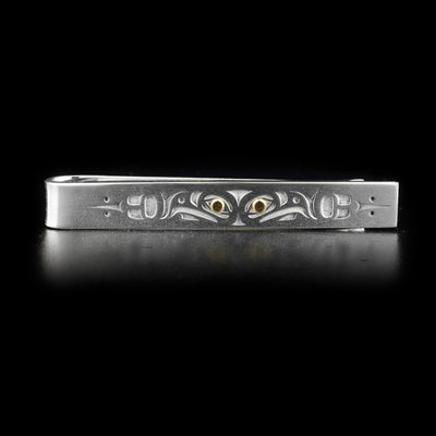 Tie clip with two eagles, 14K gold in eyes. Laser-carved design. By Tahltan artist Grant Pauls.