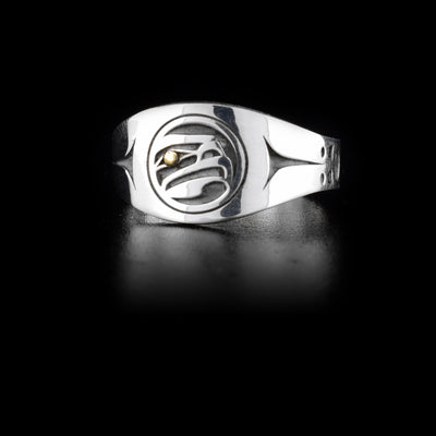 Sterling silver signet ring with side-view of eagle head facing left. 14K yellow gold in eye. Laser-carved design by Tahltan artist Grant Pauls.
