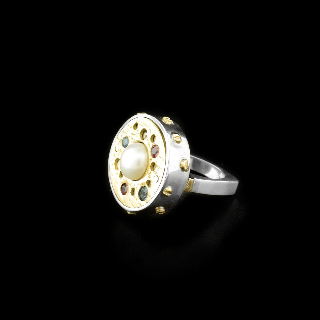 Side of ring showing square shape and dainty 14K yellow gold bolt adornments around disc on front.