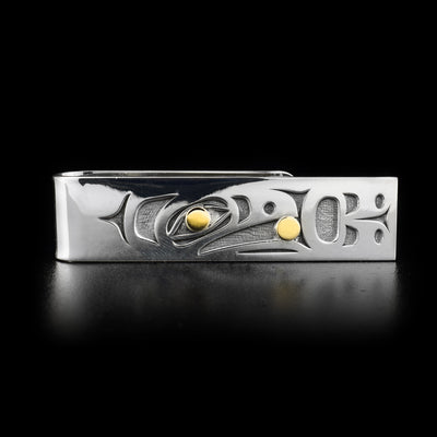 Sterling silver money clip featuring raven with 14K yellow gold ball in beak. Eye contains 14K gold as well. Laser-carved design. By Tahltan artist Grant Pauls.