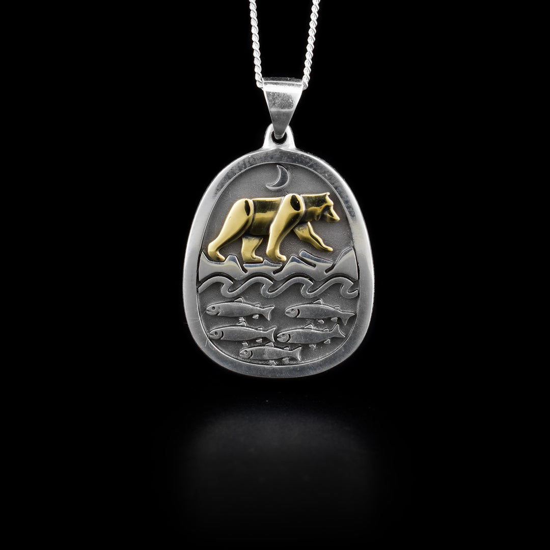 Sterling silver and 14K yellow gold bear and salmon pendant. Rhodium background. Handcrafted by Dennis Kangasniemi.