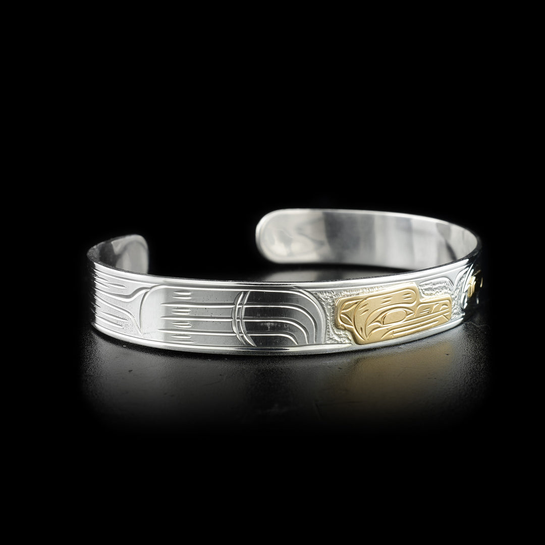 Left side photo of the bracelet depicts designs representing the bear's large paw.