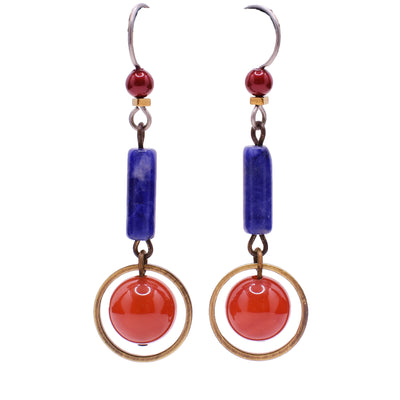 Blue and red dangle earrings made of Swarovski crystal, handworked brass, carnelian agate and sodalite. Titanium ear hooks. By Honica.
